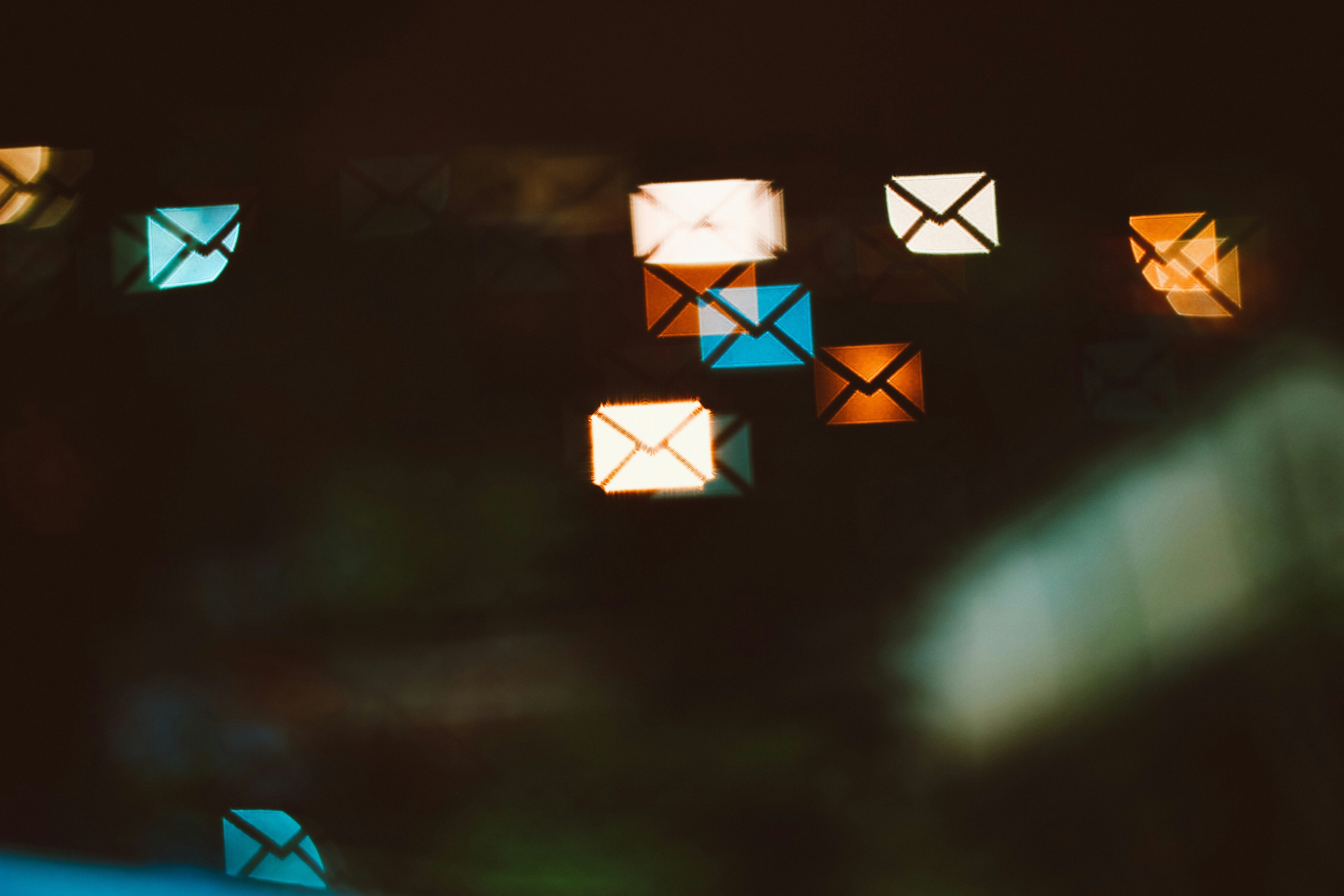 Abstract digital image of glowing email icons in motion, symbolising high-volume email marketing campaigns, automation and performance—ideal for an email marketing agency in Europe focused on EDM marketing and strategy in 2025.